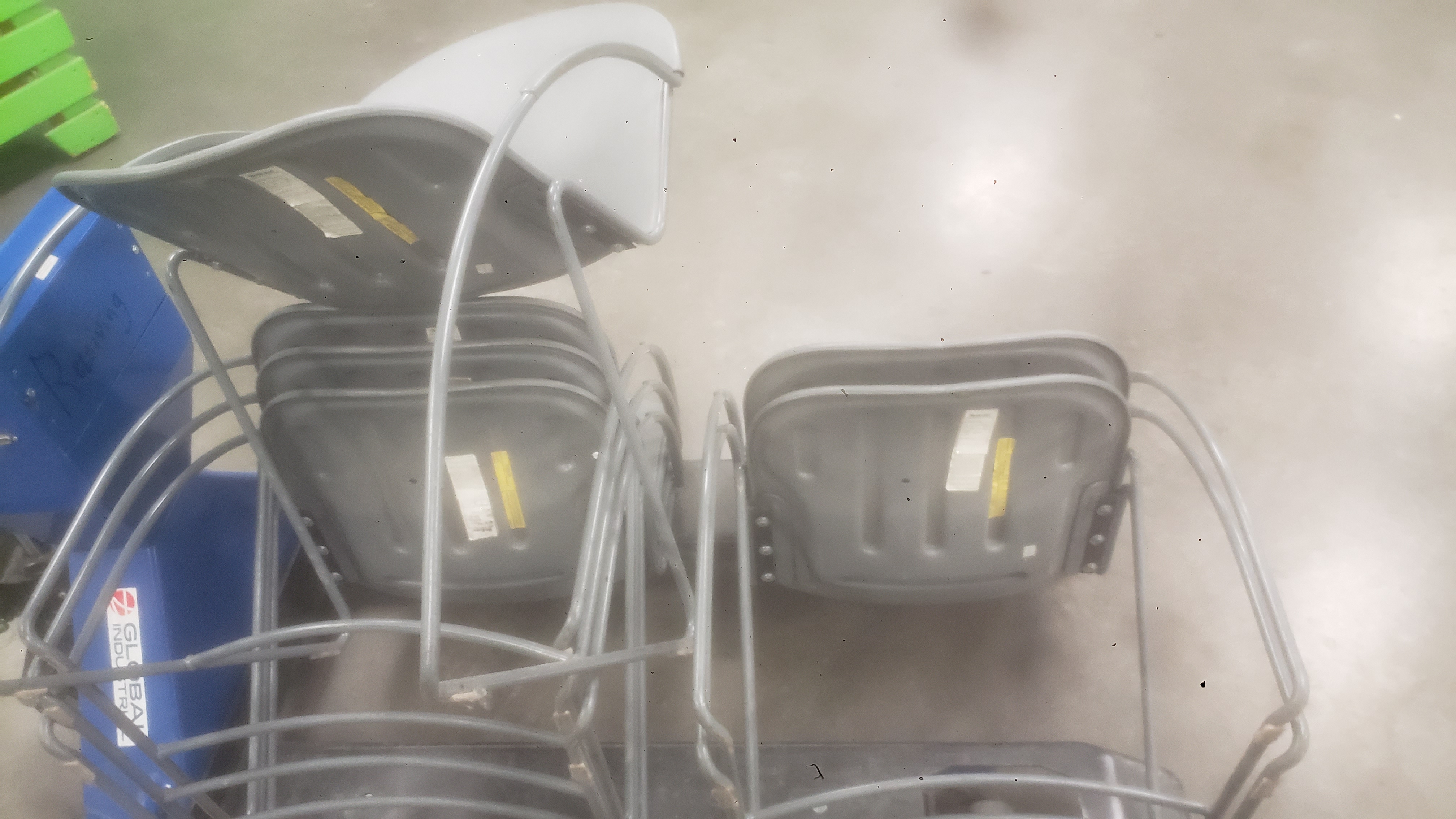 Stack of chairs on a pallet jack.